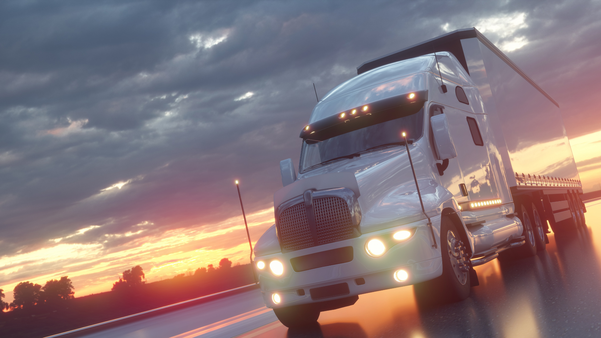 Truck driving at sunrise on the highway